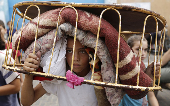 145631 634 بازگشت مردم غزه به خانه های خراب شده (تصاویر)