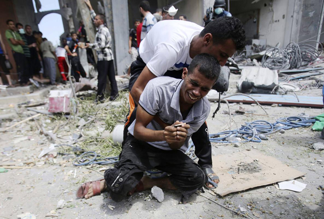 145640 405 بازگشت مردم غزه به خانه های خراب شده (تصاویر)